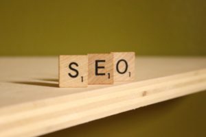 A picture of wooden letters spelling the word SEO