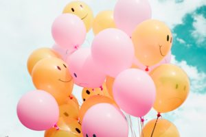 Images of sad balloons being counteracted with happy balloons