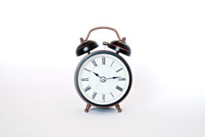 A picture of a alarm clock alerting people