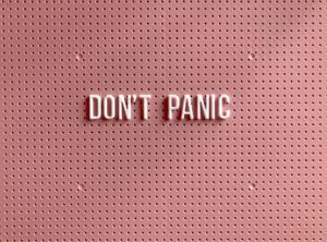 a picture of a peg board that says don't panic